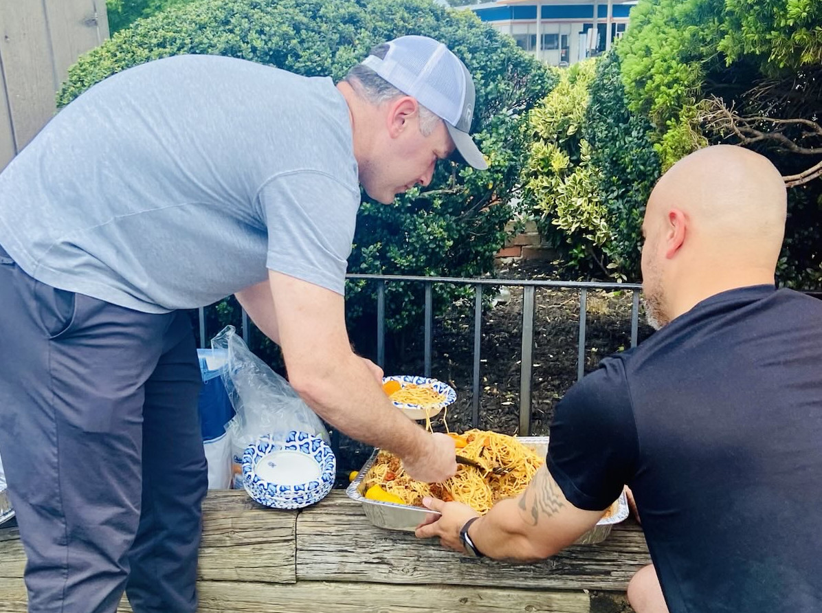 Volunteers serve food